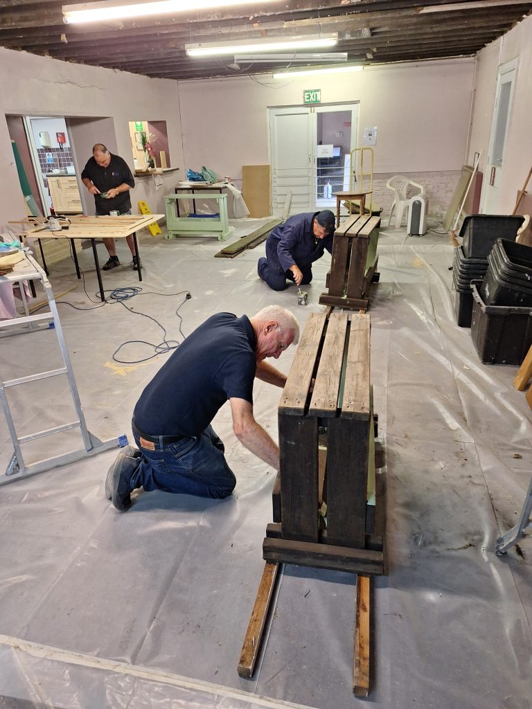 Building the new front garden seating in the social room
