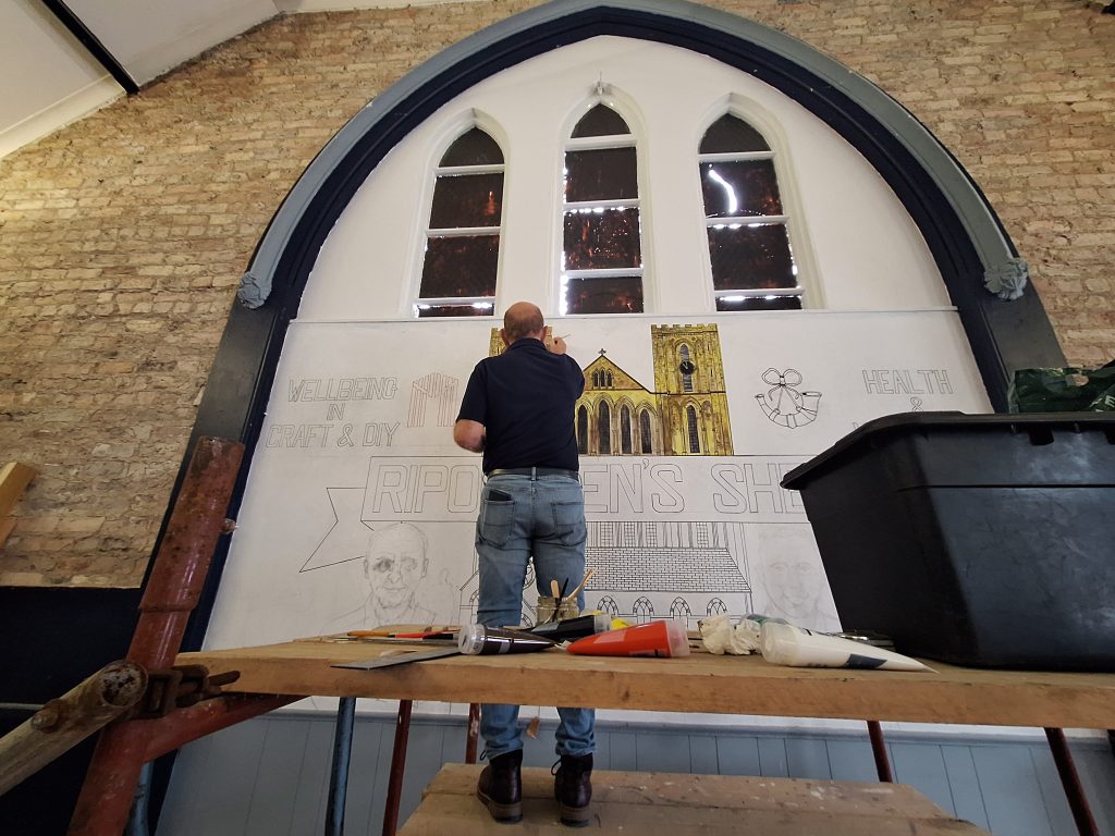 The mural being painted