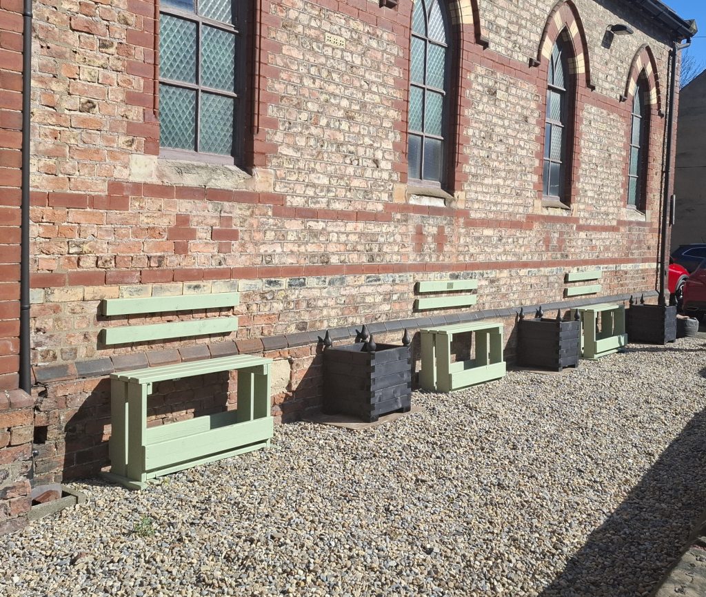 Newly installed planters and seating in our front garden